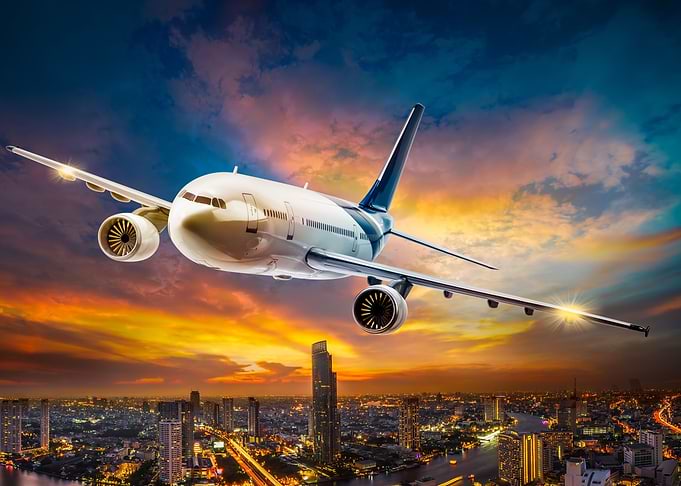 airplane over city