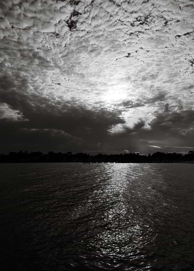 Dark Water Clouded Sky
