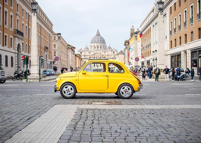 Vintage yellow car in Rome