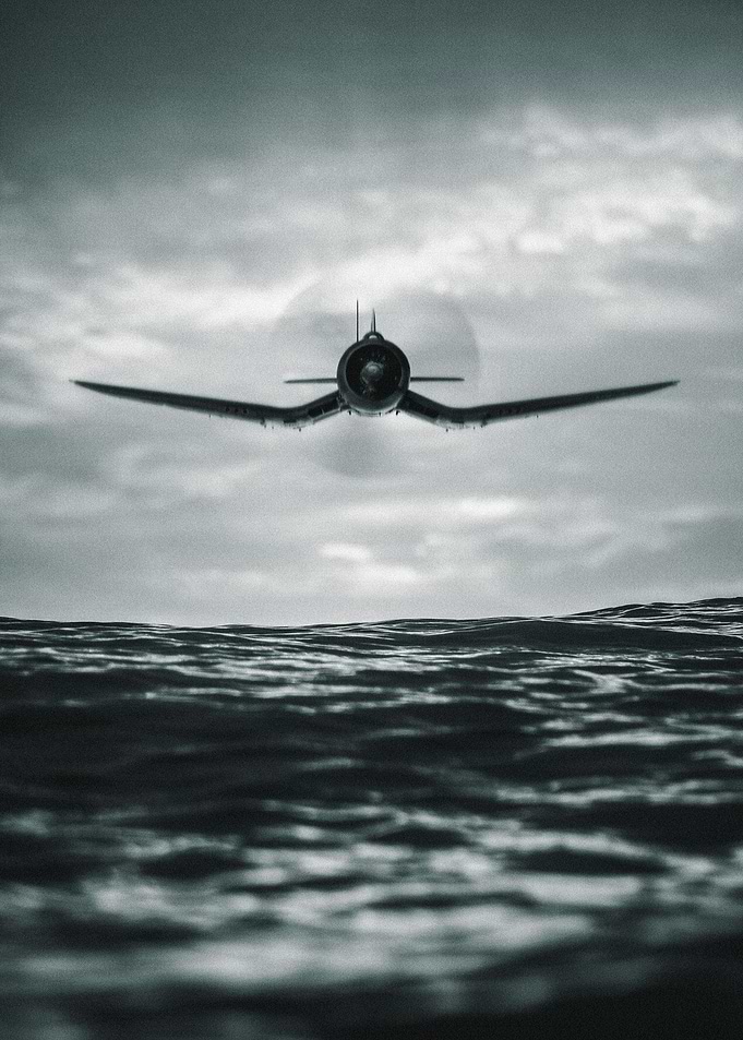 ww2 plane over the sea