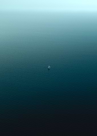 Tiny boat sailing