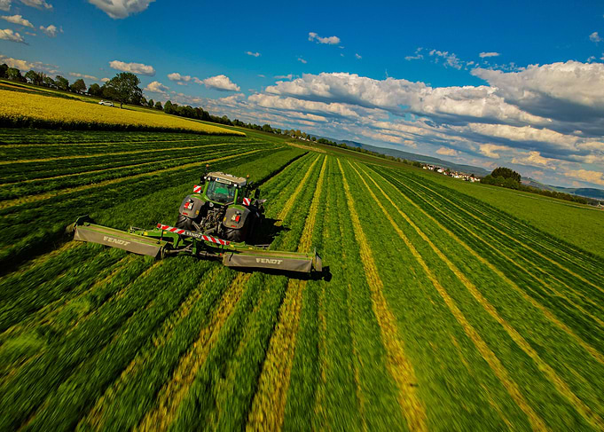 Tractor mowing fast