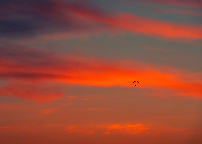 Paraglider and sunset