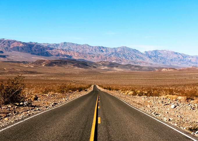 Empty Road by Mountains