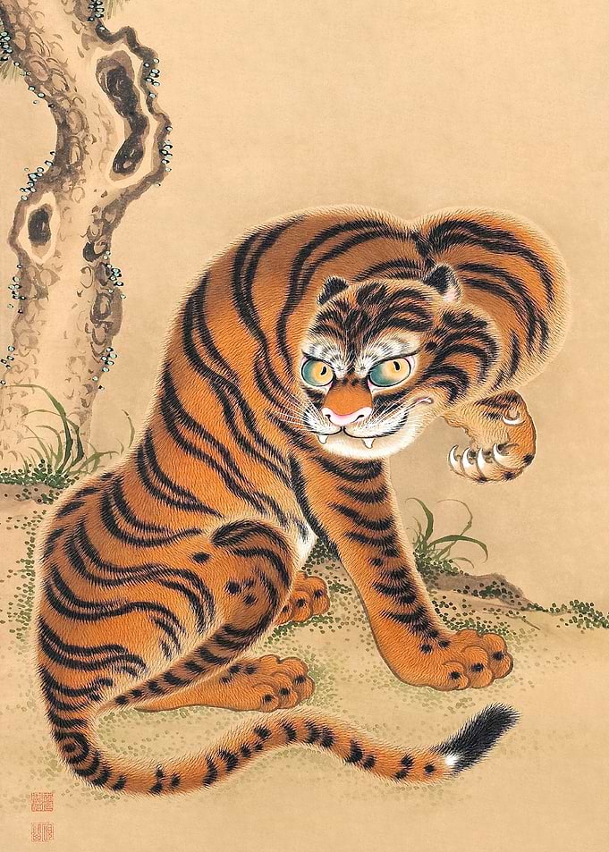 Tiger Cleaning Its Paw
