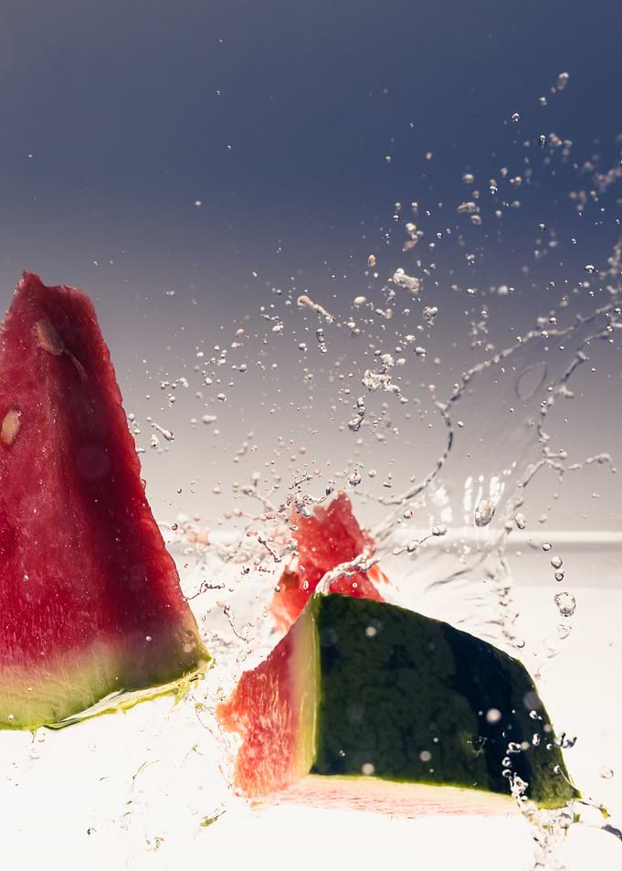 Watermelon falling into wa