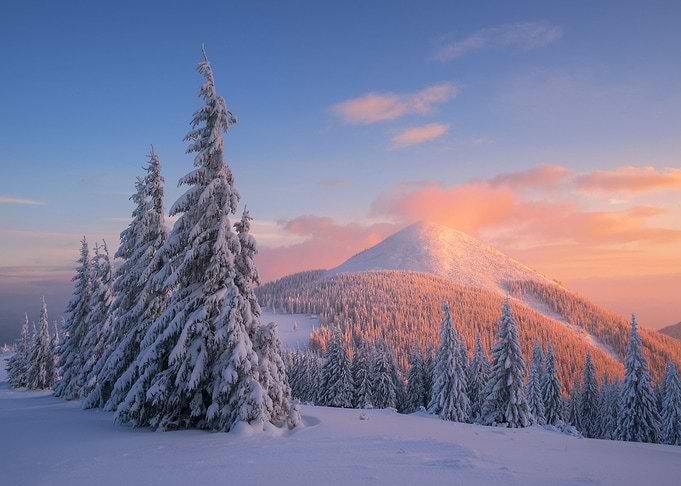 Sunset on snowy mountain