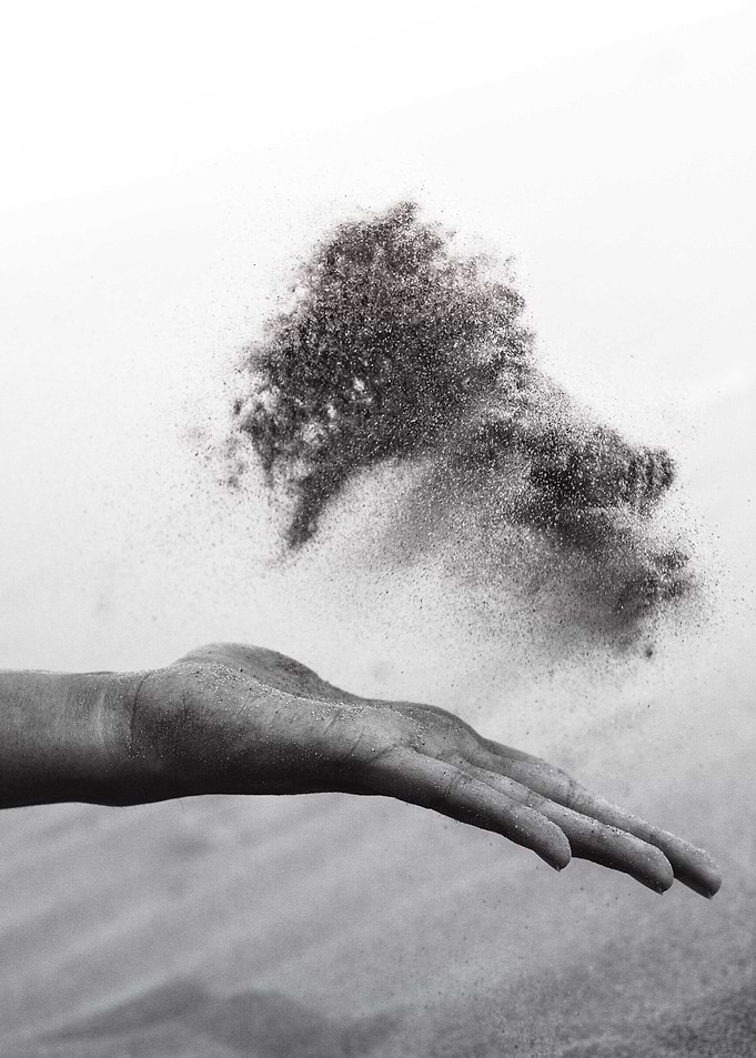 Hand Spreading Sand