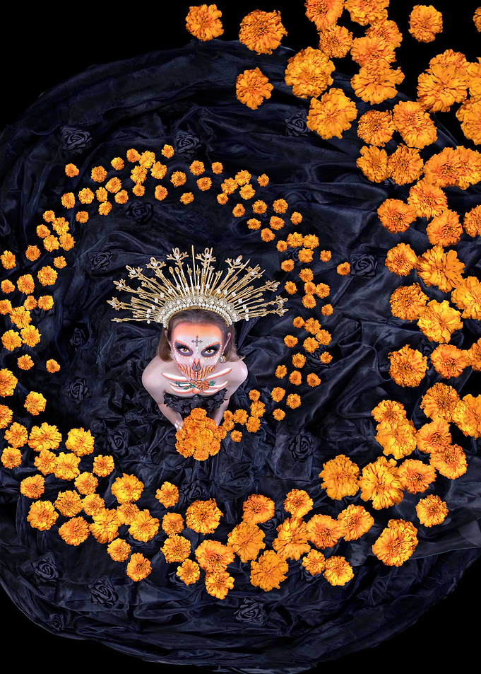 La Catrina holds a bouquet