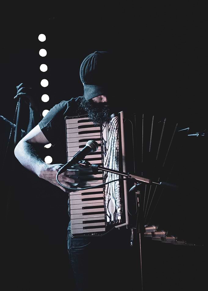 Accordeon player in dark