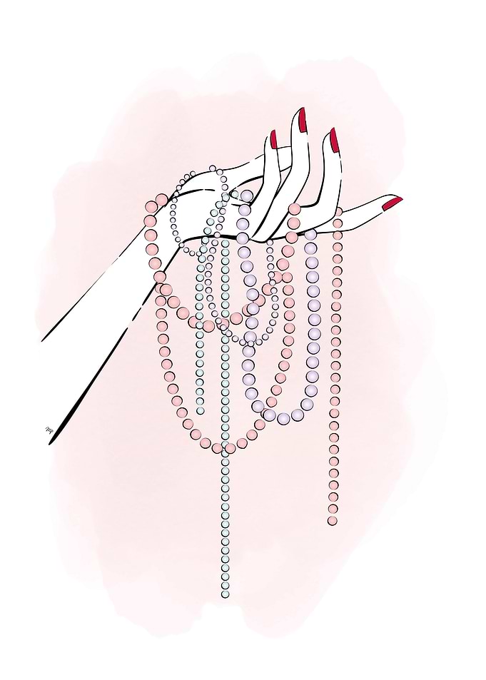 Female hand with pearls