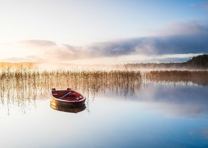 Red boat misty lake