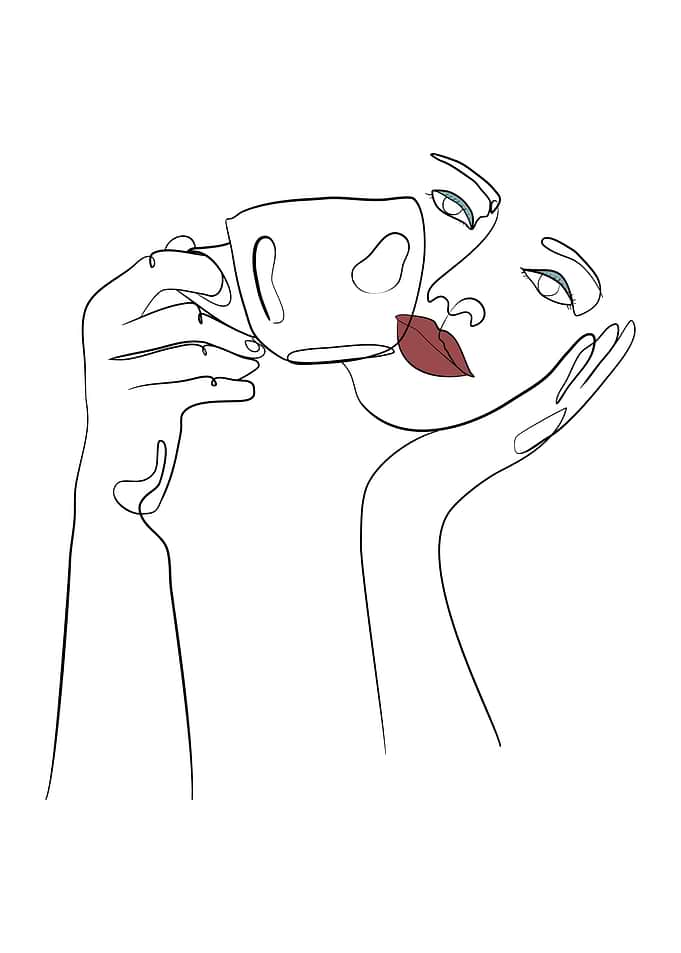 Woman holds coffee cup