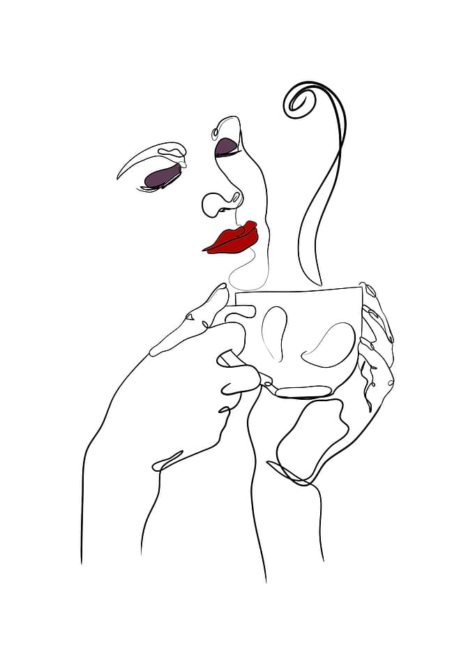 Woman holds coffee cup