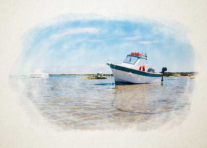White boat on sand
