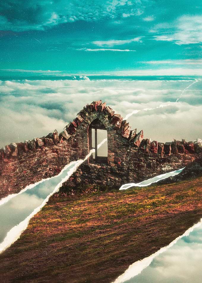 Hill surrounded by clouds