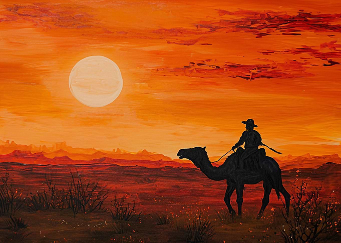 Desert camel rider at sunr