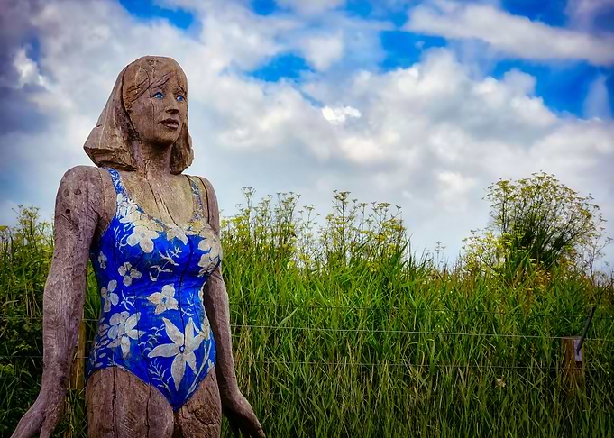 A carved wooden woman