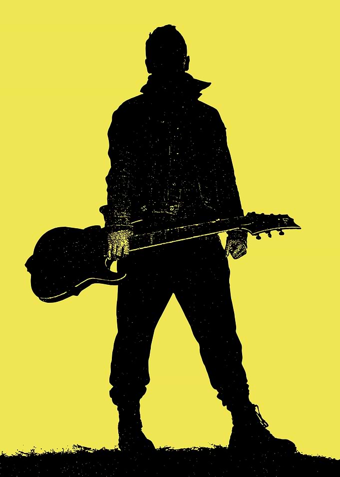 A man holding guitar