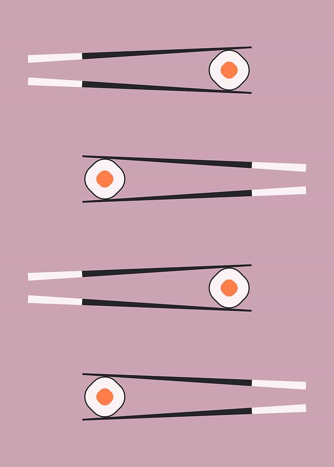 Chopsticks and sushi rolls