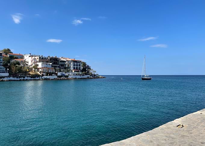 Greece: Sailboat in a Coastal Inlet