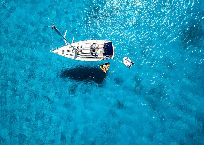 Sailboat in Turquoise Waters