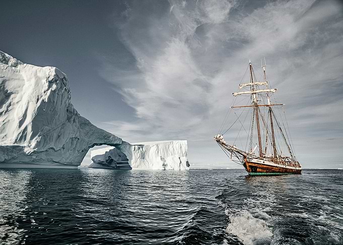 Sailing Past Iceberg