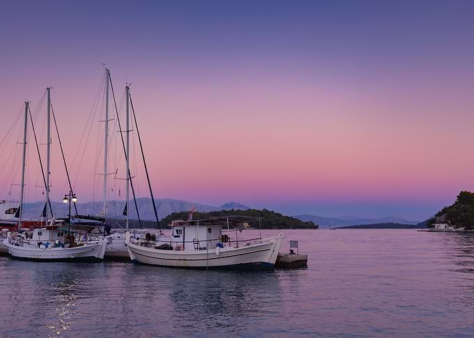 Boats from the port at sunset on the Greek island of Lefkada