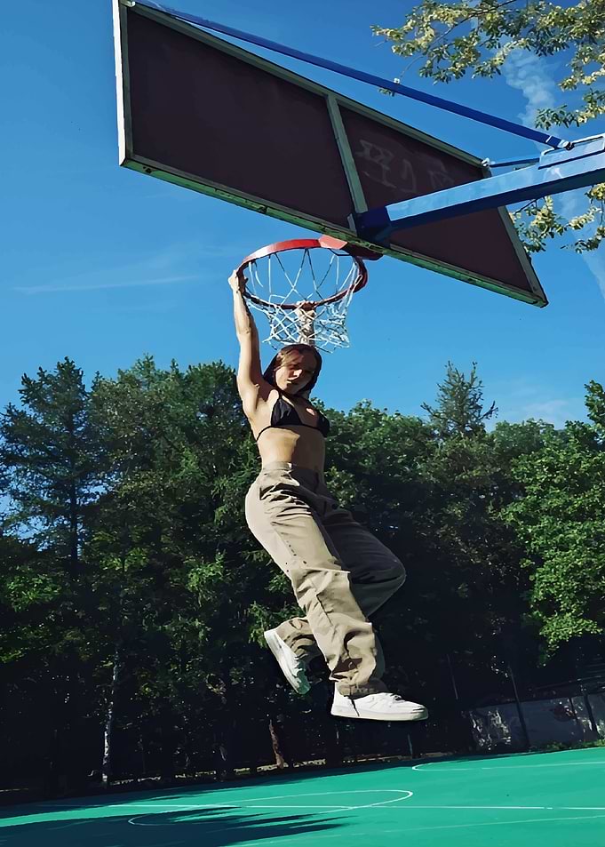 Woman Dunking Basketball