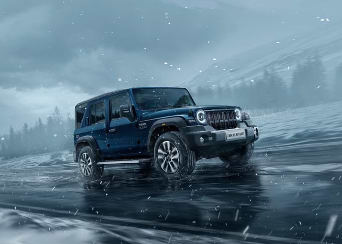 Blue Off-Road SUV in Snow