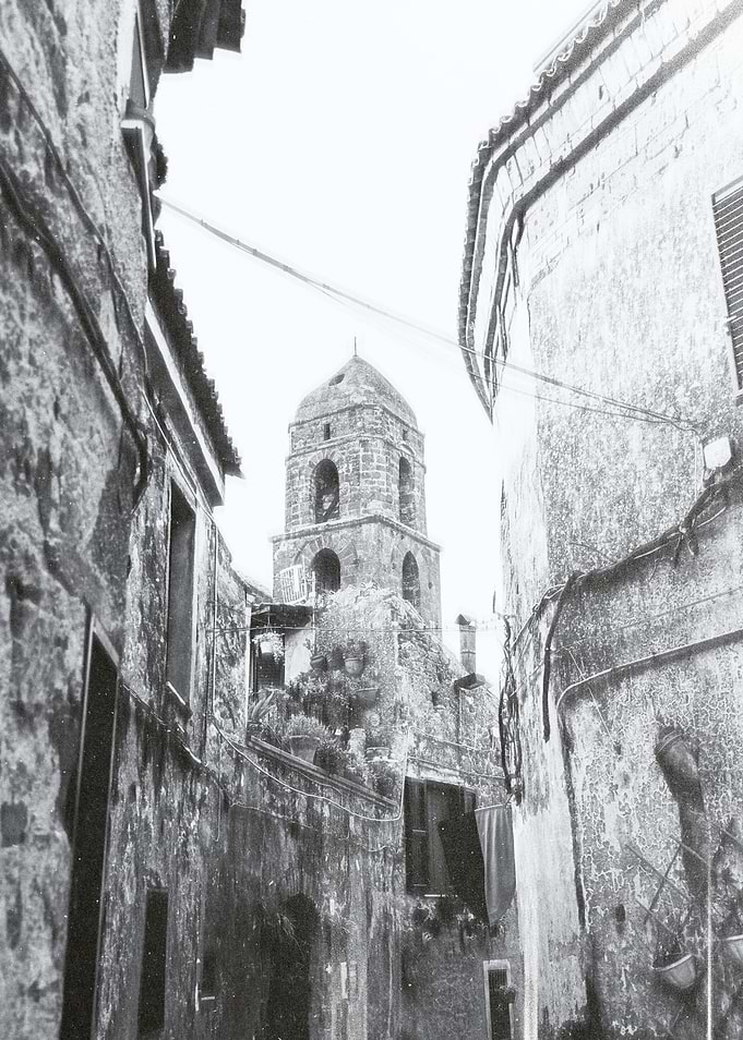 Bell Tower in Narrow Alley