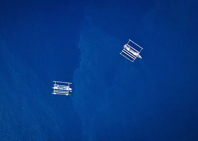 Two Boats in Blue Water