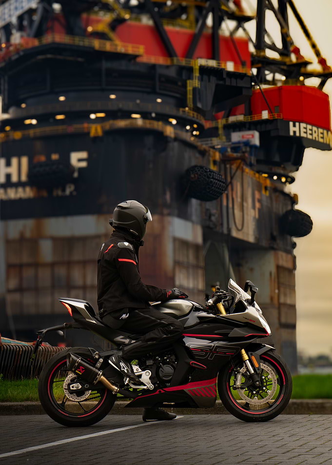 Motorcycle at oil rig, on cfmoto 450sr
