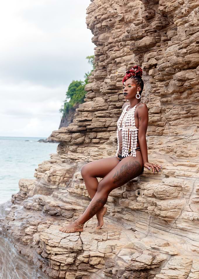 Woman in White Top on Cliff