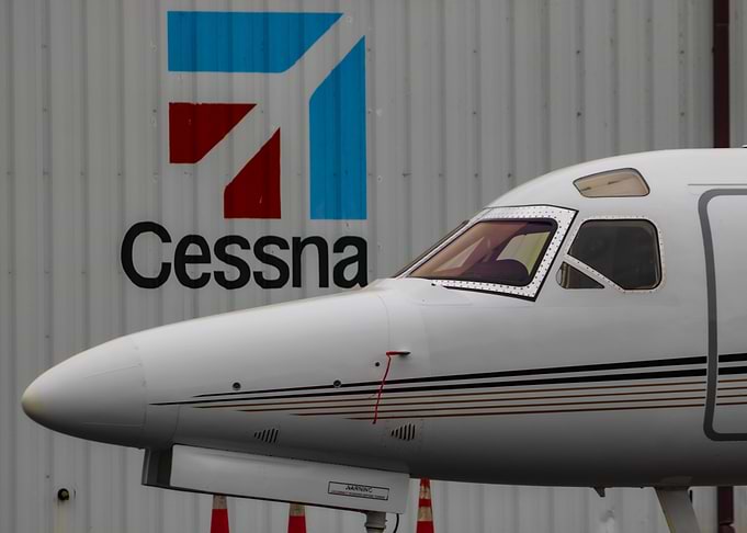 Cessna Logo Behind A Private Jet