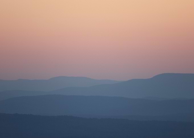 Silhouetted Mountains at Sunset