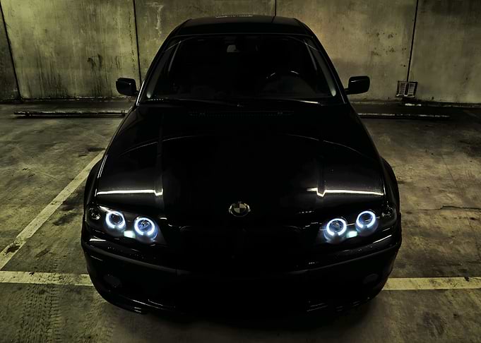 Black BMW with Angel Eyes