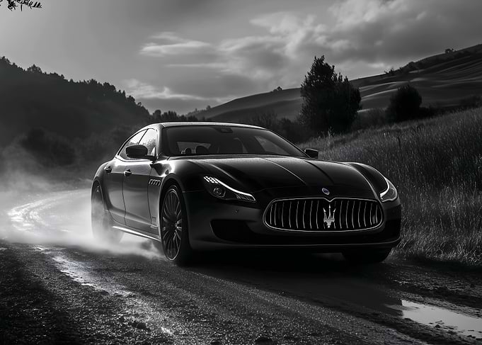 Black Maserati on a Winding Road
