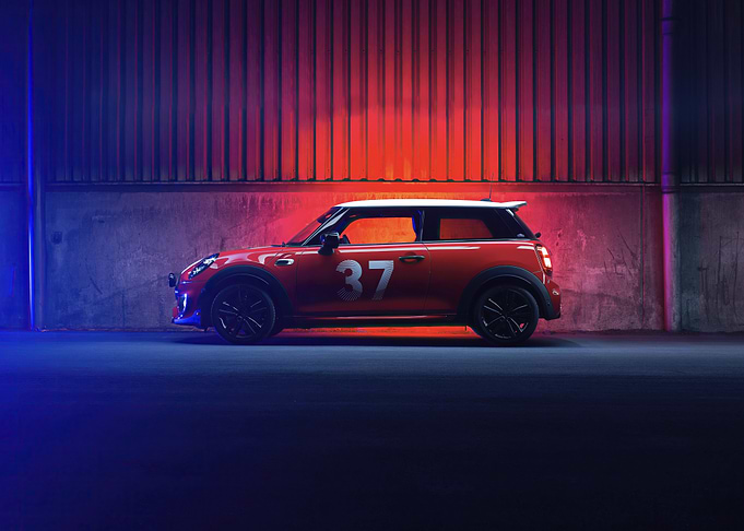Red Mini Cooper Under Neon Lights