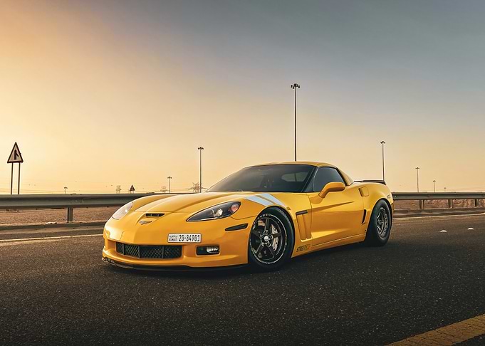 Yellow Corvette on Road