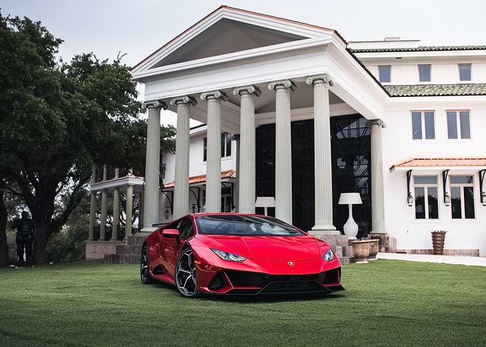 Red Lamborghini Huracan in Front of Mansion