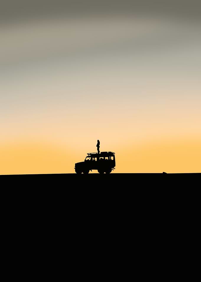 Silhouette of a Car at Sunset