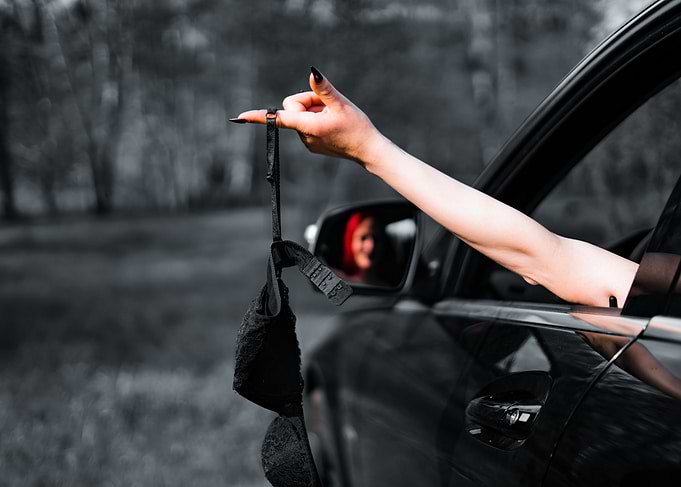 Black Bra Hanging From Car Window