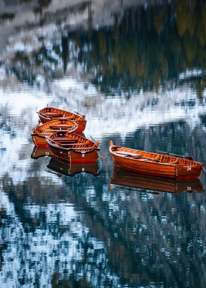 Wooden Boats on Calm Lake