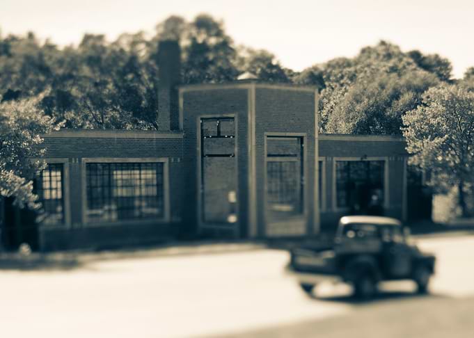 Vintage Brick Building with Retro Truck