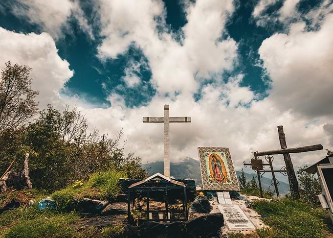 Cross and Shrine in Mountains