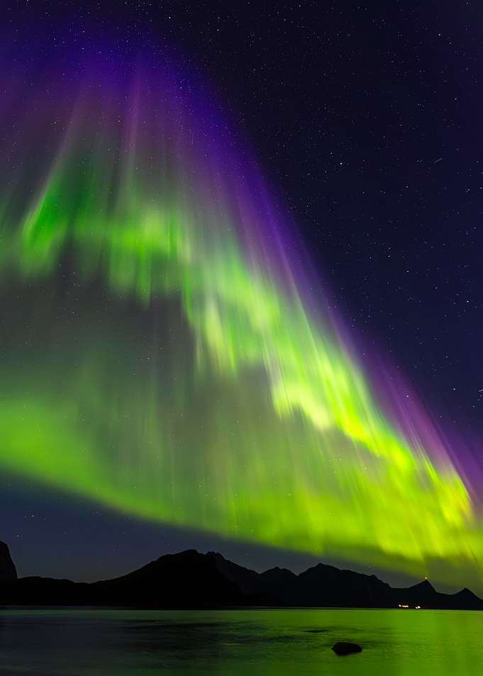 Green to Blue Aurora Borealis over Mountains at Lofoten