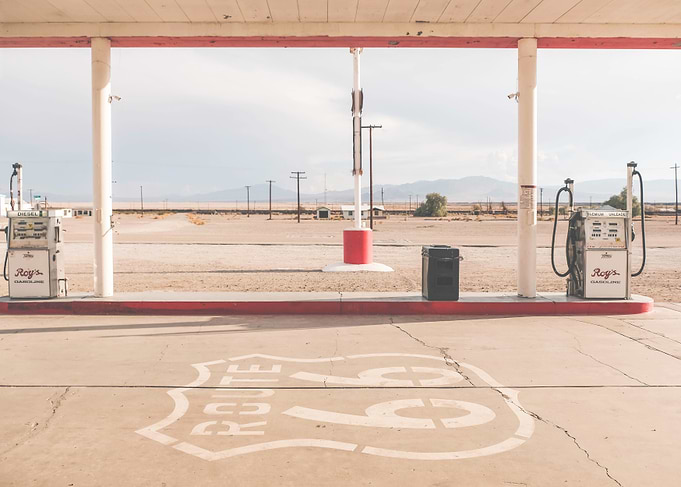 Route 66, USA I Retro vintage gas station in California Mojave Desert with sunny pastel aesthetic at the legendary Roy's Motel Cafe in the American countryside with its analog film ambience vibes
