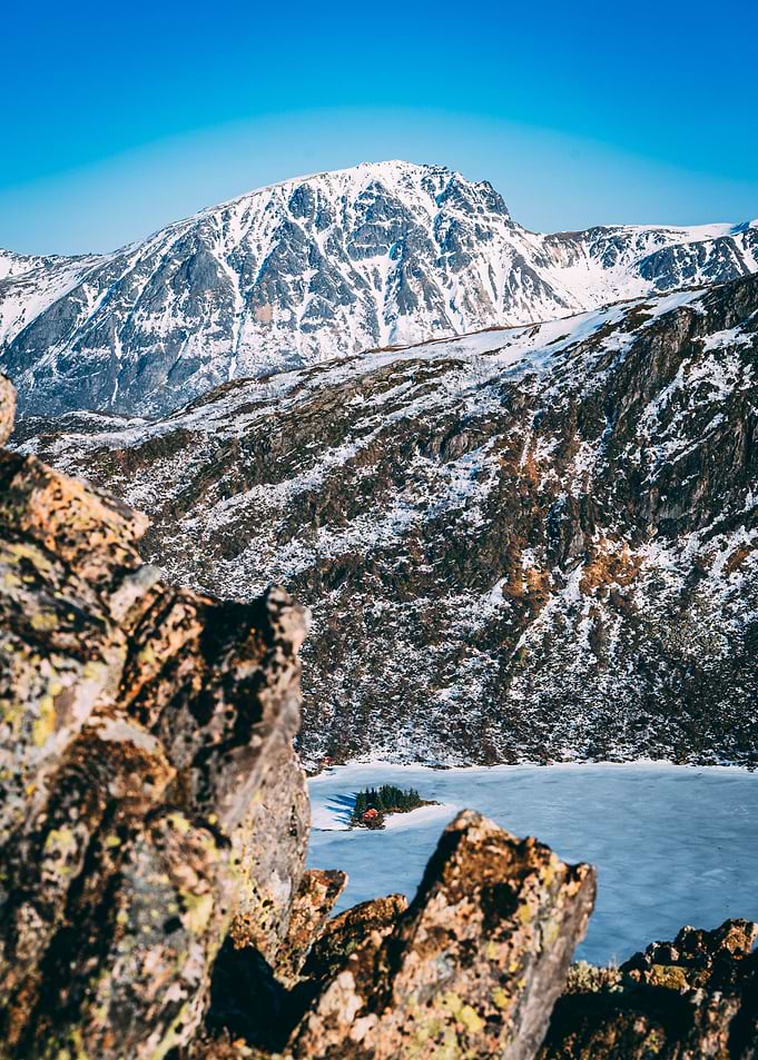 Mountain View on a lonely House in a Norwegian Lake