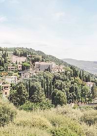 Florence, Italy I Tuscan landscape at Fiesole with mountains and cypresses, as near Milan or Rome in greenery nature with retro vintage pastel summer aesthetic of italian countryside old villages